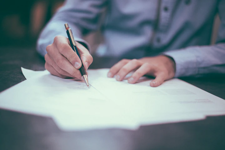 Founder signing incorporation papers
