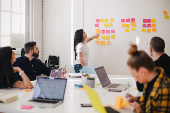 Team planning on a wall of sticky notes